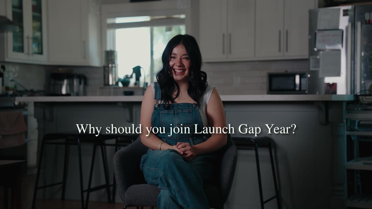 A Launchpad Gap Year student smiling in a bright kitchen during a testimonial interview
